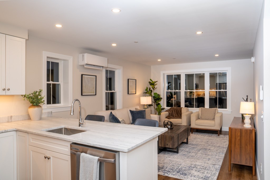 Staged Scittery Woods townhome living room and kitchen photographed by LeporeMedia